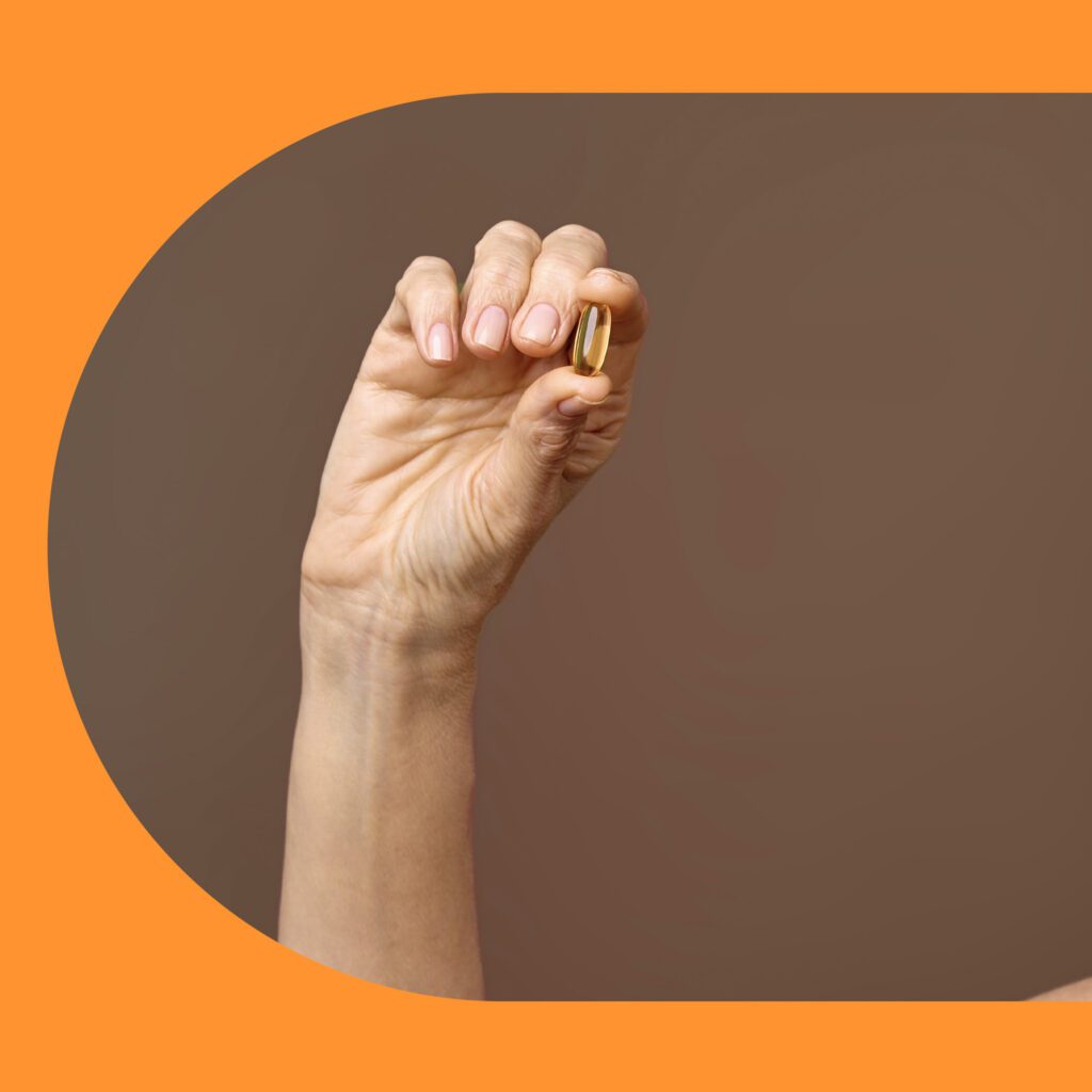 a man showing the yallow pills