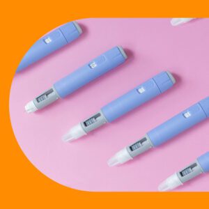 Five blue insulin pens with dosage indicators
